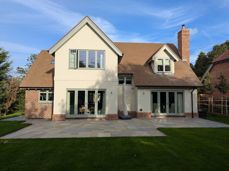 Striking new-build home with clean architectural lines softened by new planting
