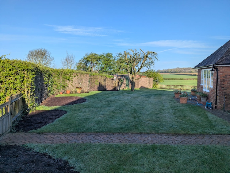 Beds enriched with organic compost ready for the new planting scheme