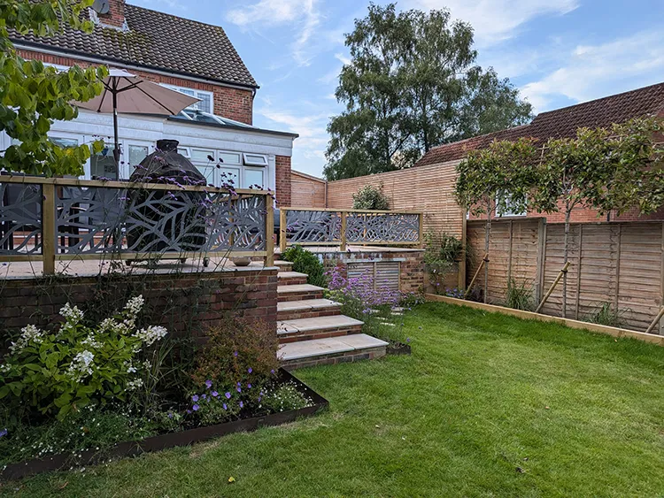 Wide angle shot of the built garden with railing and steps built