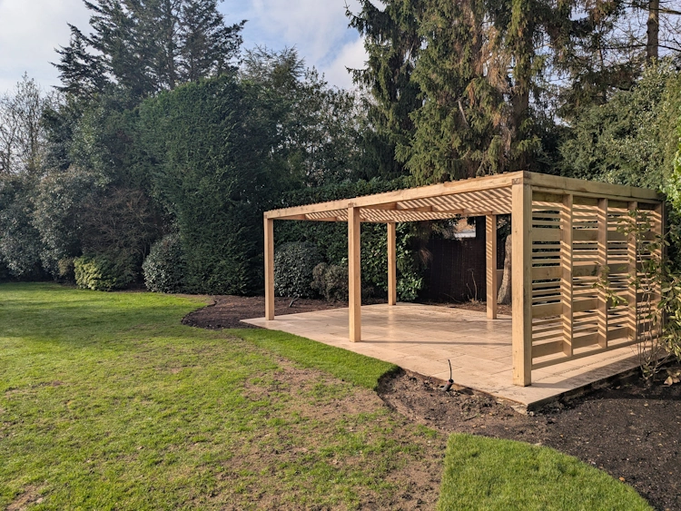 Partially enclosed pergola sides creating a sheltered, private spot for entertaining