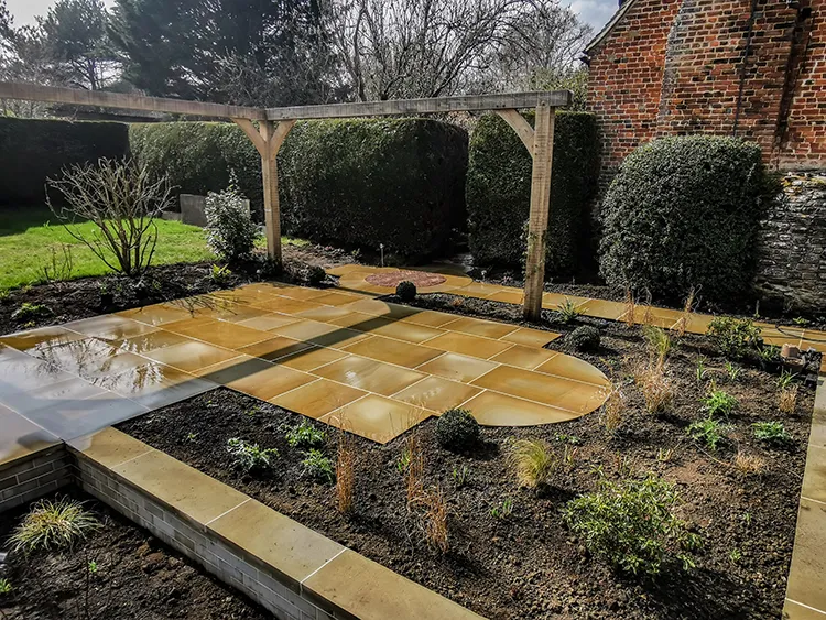 Newly landscaped garden with york stone paving