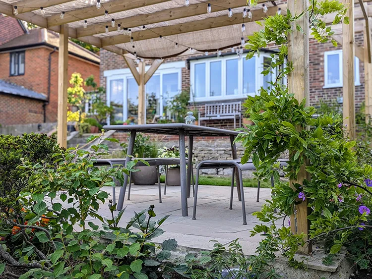 Another photo of the terrace with a pergola over it